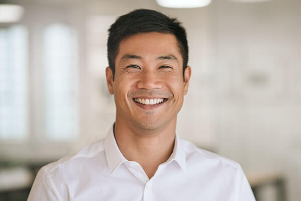 AdvancedSleepandTMJSolutionsKrissyConnersDDS-asian-businessman-smiling
